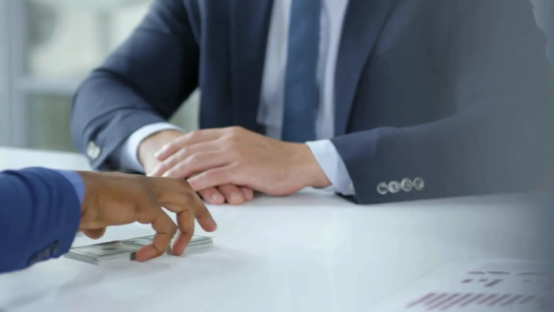 Seller and buyer shaking hands after negotiation