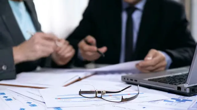 Bank officer reviewing SBA underwriting requirements