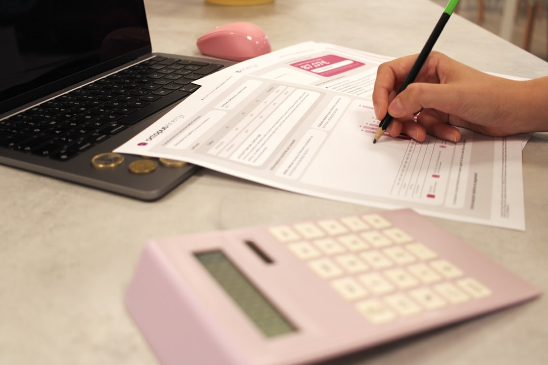 loan application paperwork on desk calculator pen bank statements
