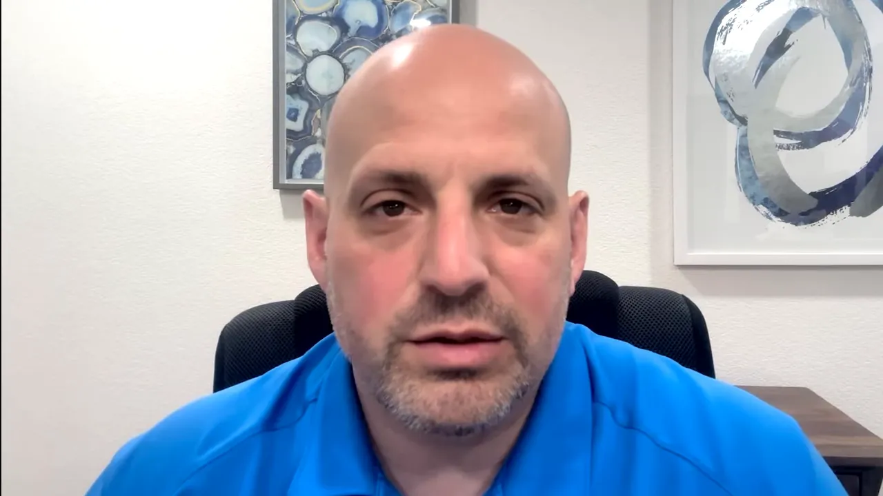 Centered close-up of podcast host explaining negotiation of senior loan terms for SBA 504 deals.