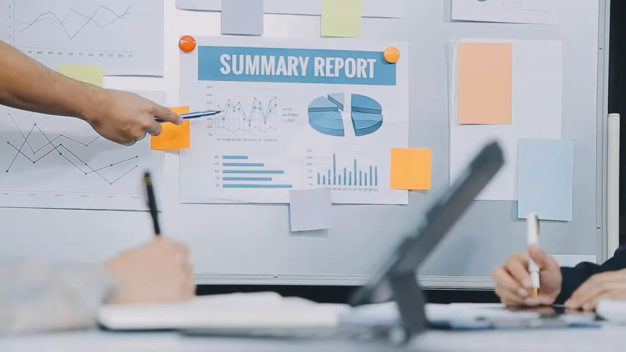 Summary report pinned to a board with charts and sticky notes, hands pointing and taking notes