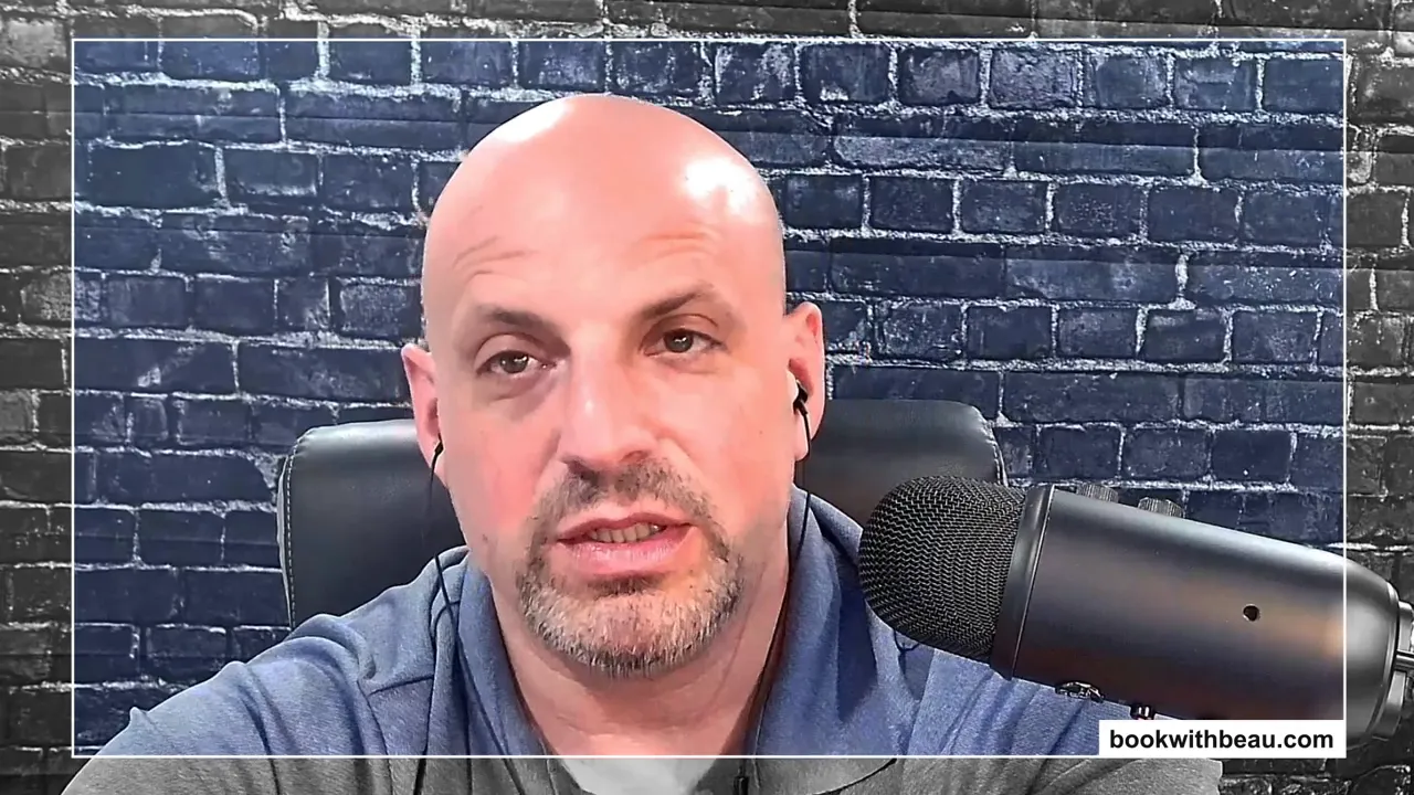 Well-lit podcast host speaking into a microphone with brick background, clear facial expression.
